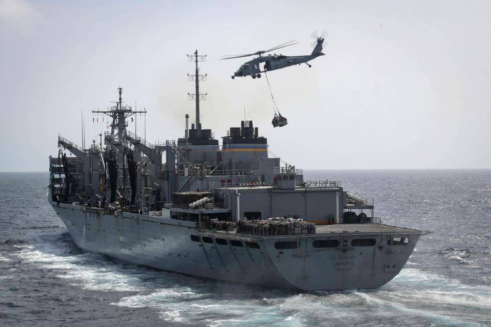 In this Sunday, May 19, 2019, photo released by the U.S. Navy, an MH-60S Sea Hawk helicopter fr ...
