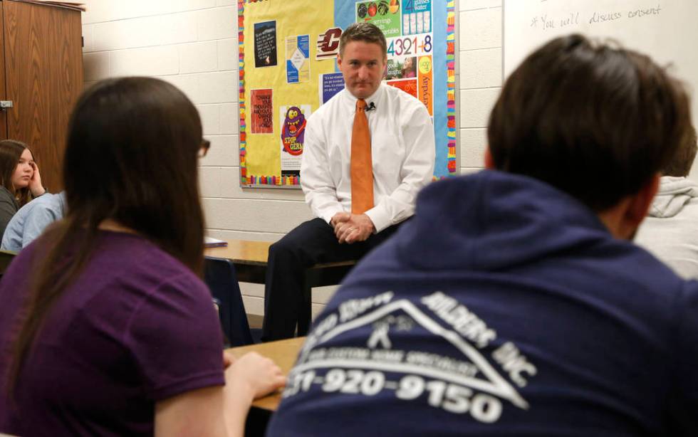 Jason Elmore, the prosecutor in Wexford County, Mich., listens to a student's question during a ...