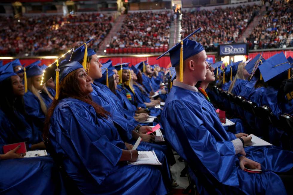Graduates, including Ramona Schafer, left, listen to speakers during College of Southern Nevada ...