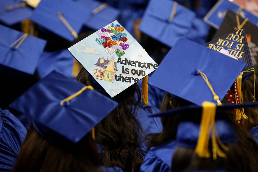 Graduates don personalized mortarboards during College of Southern Nevada commencement ceremony ...