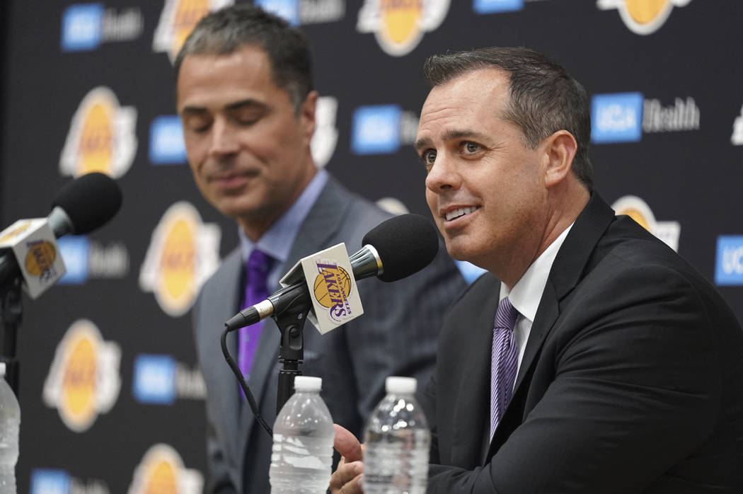 Los Angeles Lakers NBA basketball team general manager Rob Pelinka, left, introduces Frank Voge ...