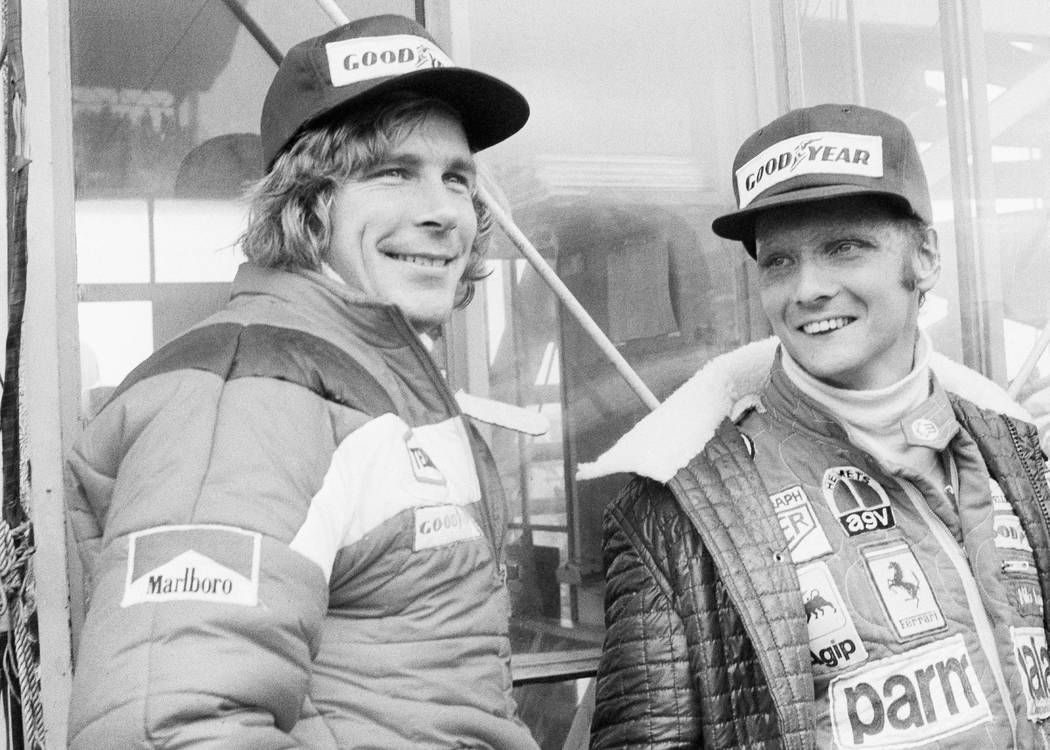 In this Oct. 24, 1976, file photo, Austrian auto racer Niki Lauda, right, defending champion in ...