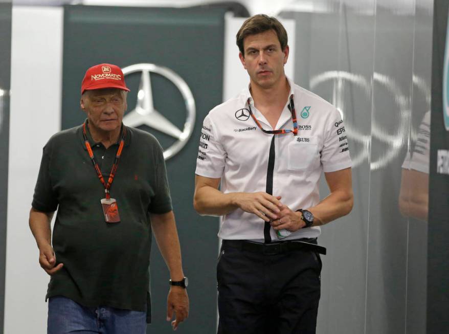 In this Saturday, Sept. 19, 2015 file photo Head of Mercedes-benz Motorsports Toto Wolff, right ...