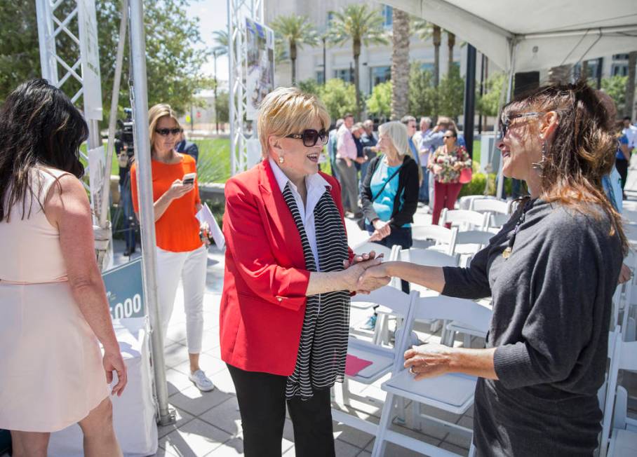 Mayor Carolyn Goodman, middle, shakes hands with artist Niki Sands during a ground breaking cer ...