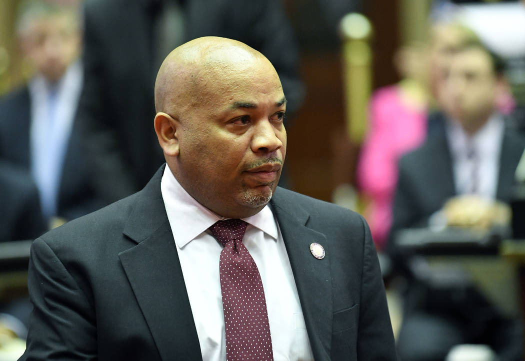 Assembly Speaker Carl Heastie, D-Bronx, left, walks on the Assembly floor as members of the New ...
