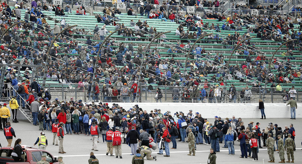 Fans return to the stands following an infield concert before a NASCAR Cup Series auto race at ...
