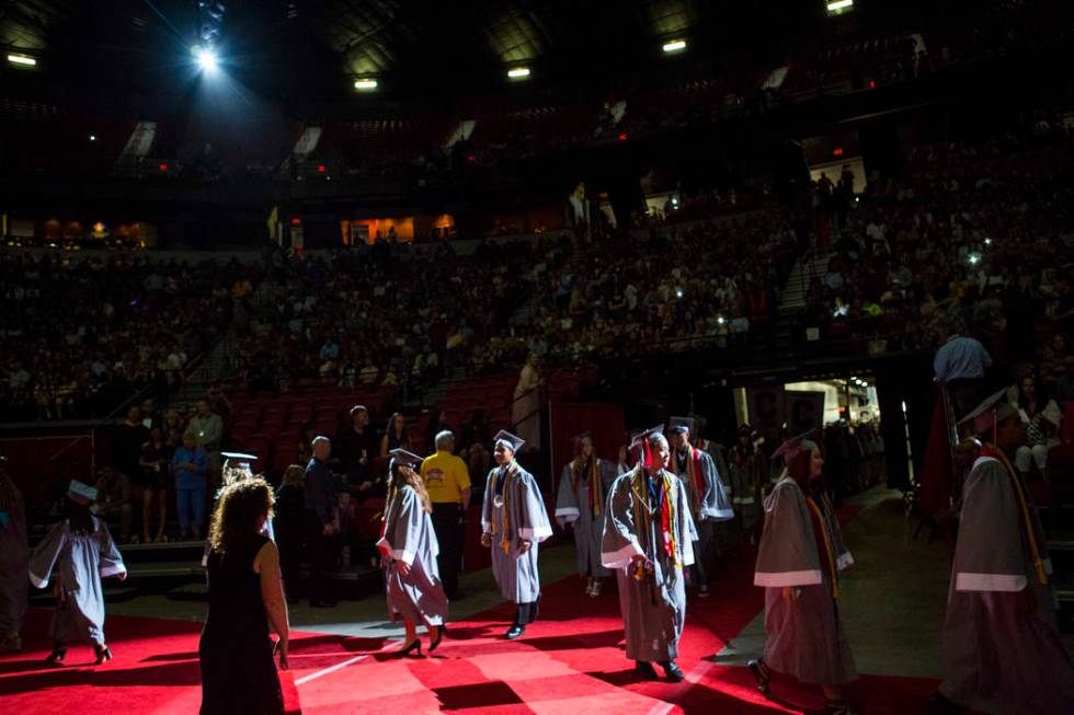 Graduating Coronado High School valedictorians walk during the processional at their graduation ...