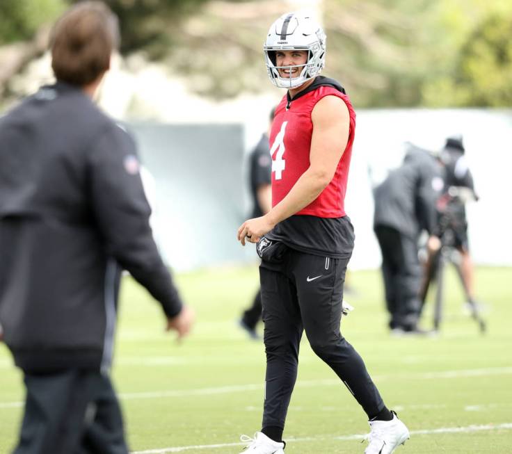 Oakland Raiders quarterback Derek Carr smiles during an offseason training session at the team' ...