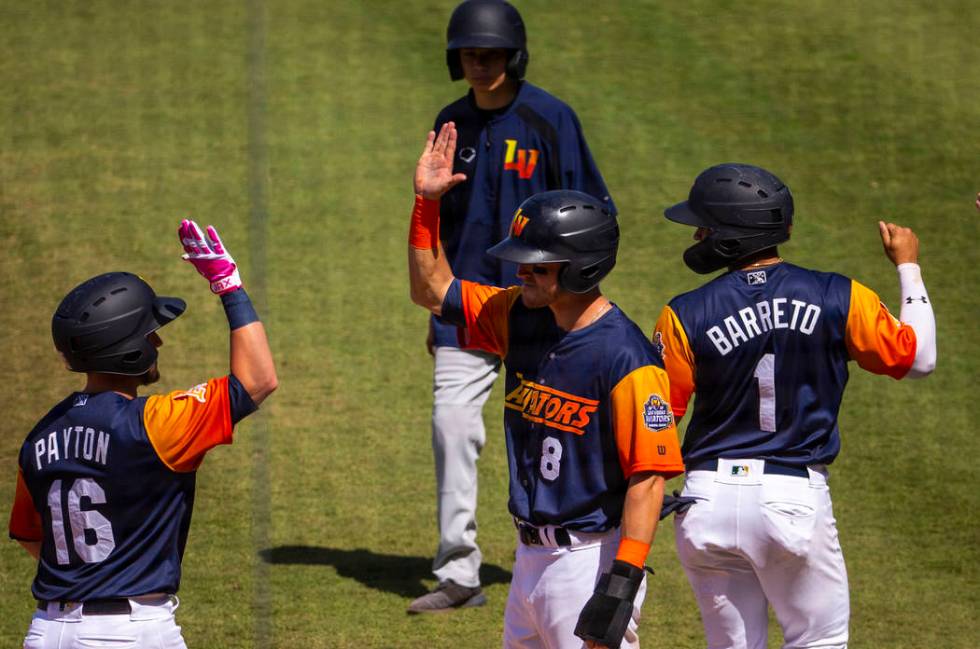 Aviators players celebrate a grand slam late in the game versus the Tacoma Rainiers at the Las ...