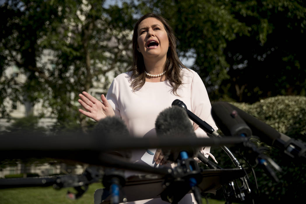 White House press secretary Sarah Huckabee Sanders speaks to reporters on the North Lawn outsid ...