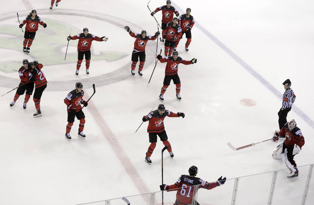 Canada's Mark Stone, foreground, celebrates after scoring his side's third goal during the Ice ...