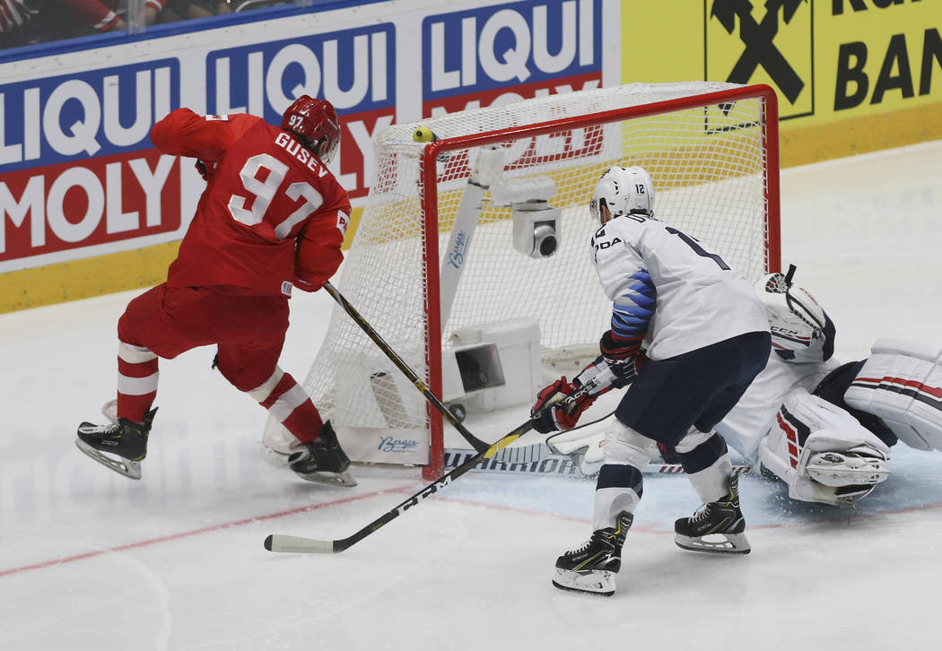Russia's Nikita Gusev, left, scores his side's first goal during the Ice Hockey World Champions ...