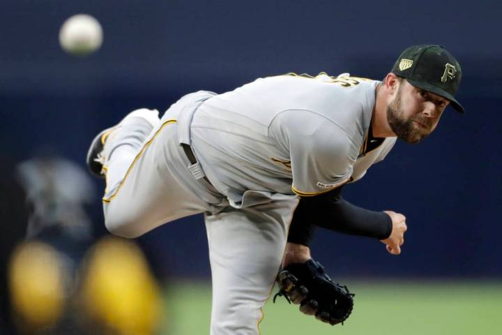 Pittsburgh Pirates starting pitcher Jordan Lyles works against a San Diego Padres batter during ...