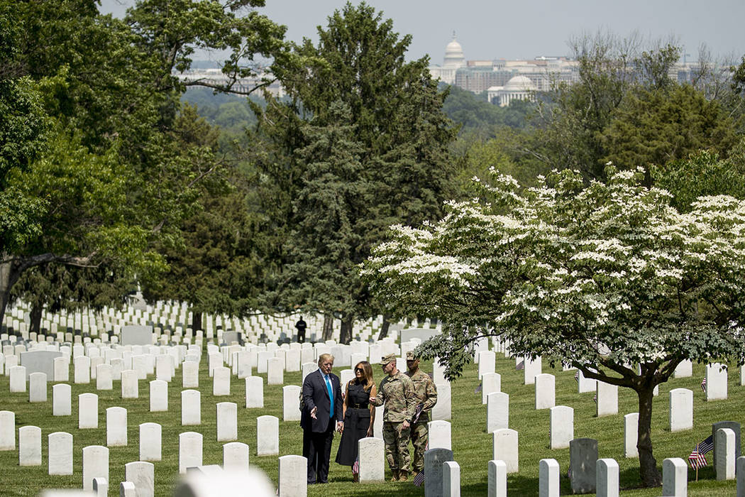 The U.S. Capitol dome is visible in the background as President Donald Trump and first lady Mel ...