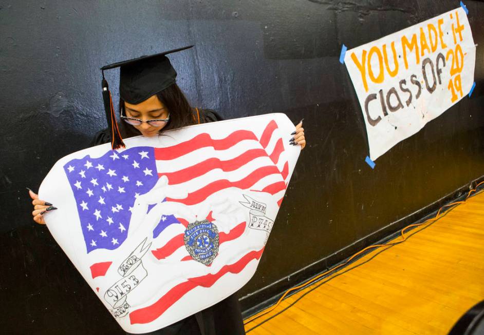 Cassandra Sosa shows off her winning mural during a graduation ceremony rehearsal at Chaparral ...