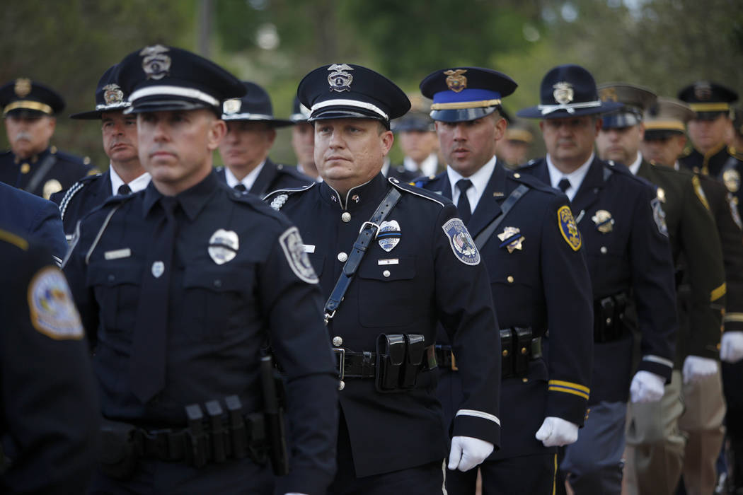 The honor guard walks to the front of the Southern Nevada Law Enforcement Officers memorial ser ...