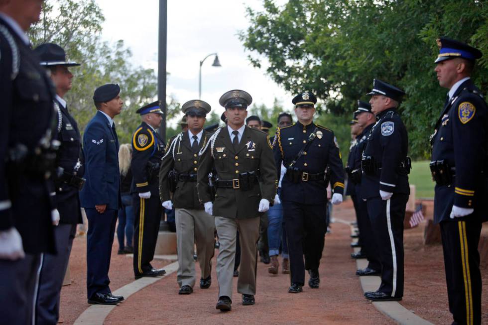 The honor guard walks to the front of the Southern Nevada Law Enforcement Officers memorial ser ...