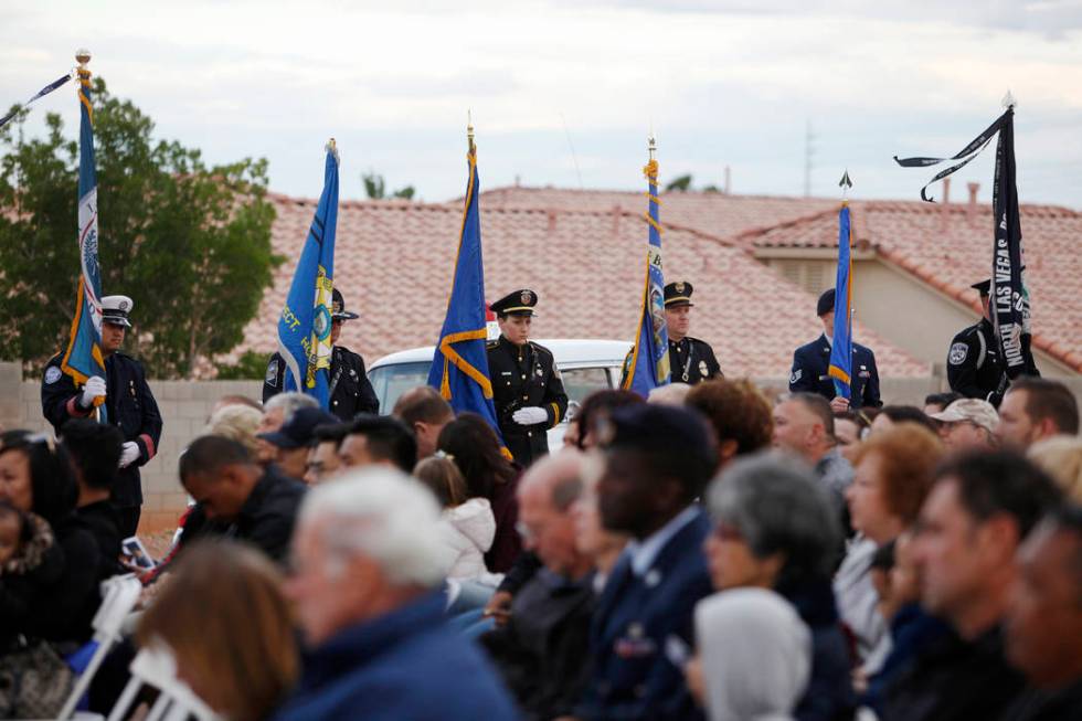 The flag detail stands over the crowd at the Southern Nevada Law Enforcement Officers memorial ...