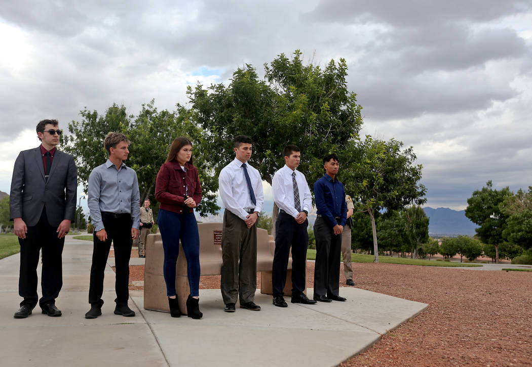 Students with parents who are active-duty LVMPD police and corrections officers line up to rece ...