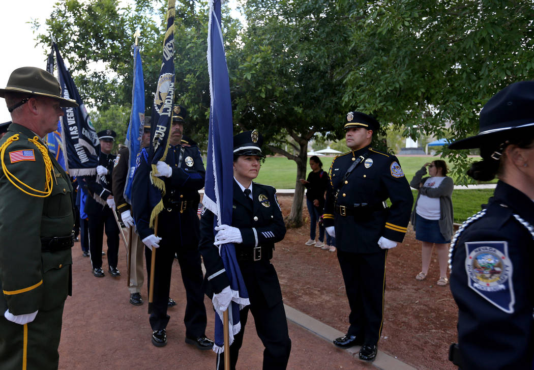 The flag detail walks toward the stage at the Southern Nevada Law Enforcement Officers memorial ...