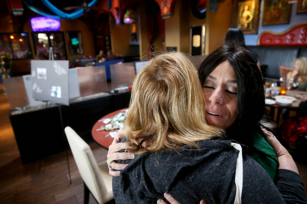 Courtney Kaplan, right, mother of Michael "Mikie" Sigler, the Cimarron-Memorial High ...