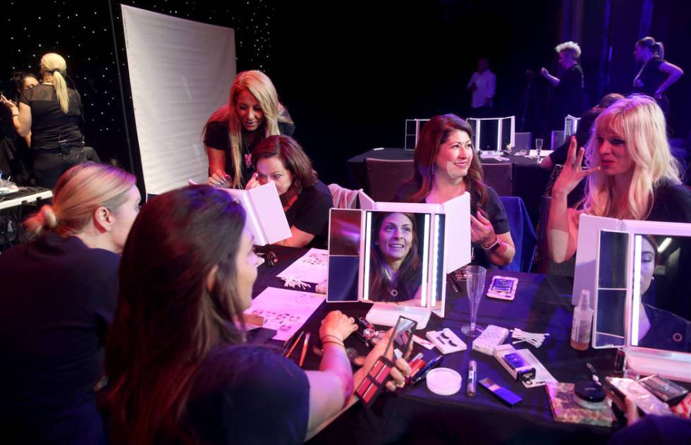 Coaches work with students during a preview of Showgirl Bootcamp at Saxe Theater in Miracle Mil ...