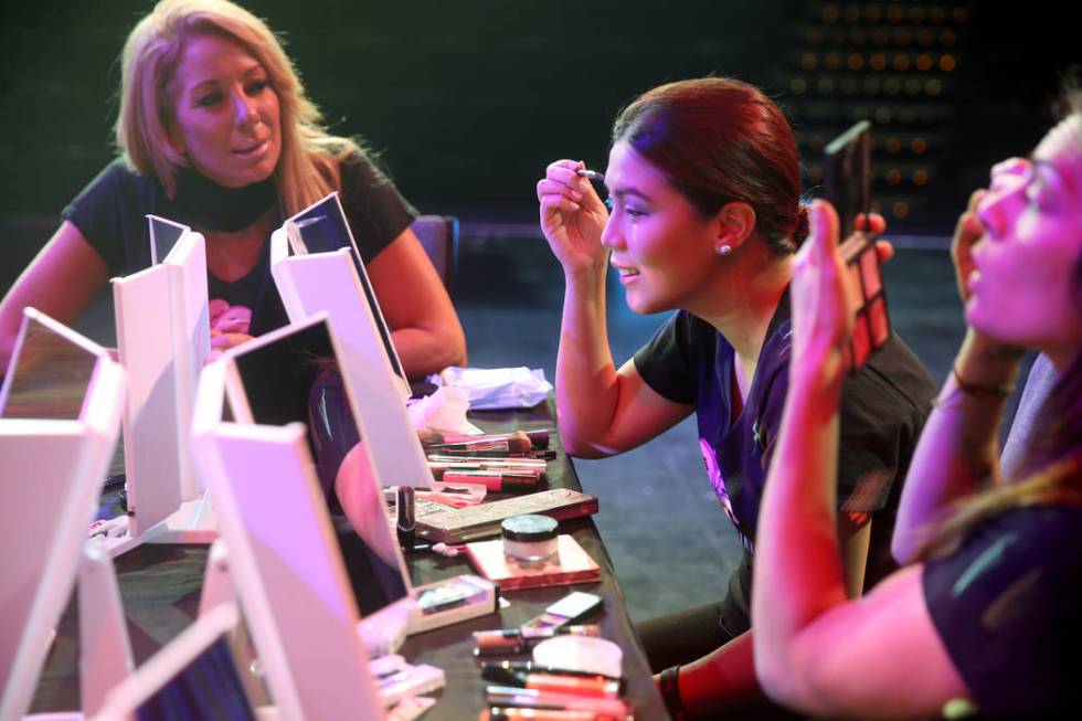 Coache Gabriella Versace, left, works on makeup with Marianne Tanada of Henderson during a prev ...