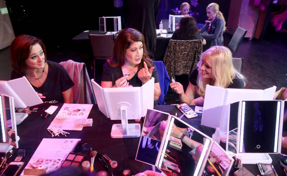 Coach Dar Brzezinski, right, works on makeup with Glenda Damien, center, and Marla Laughlin, bo ...