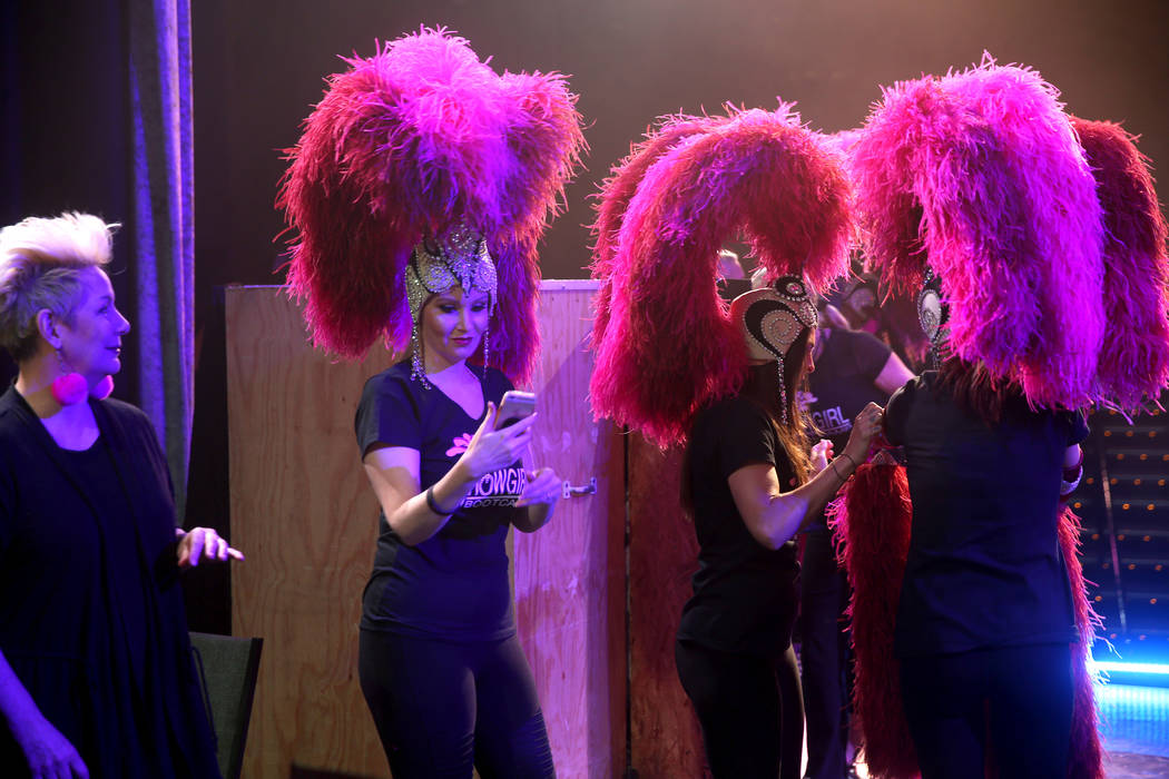 Jacqueline Hill of Henderson takes a selfie as co-creator Mistinguett, left, looks on during a ...