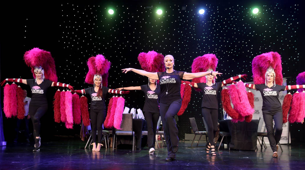 Co-creator Stacy Law-Blind, foreground, teaches the showgirl walk to, from left, Jacqueline Hil ...