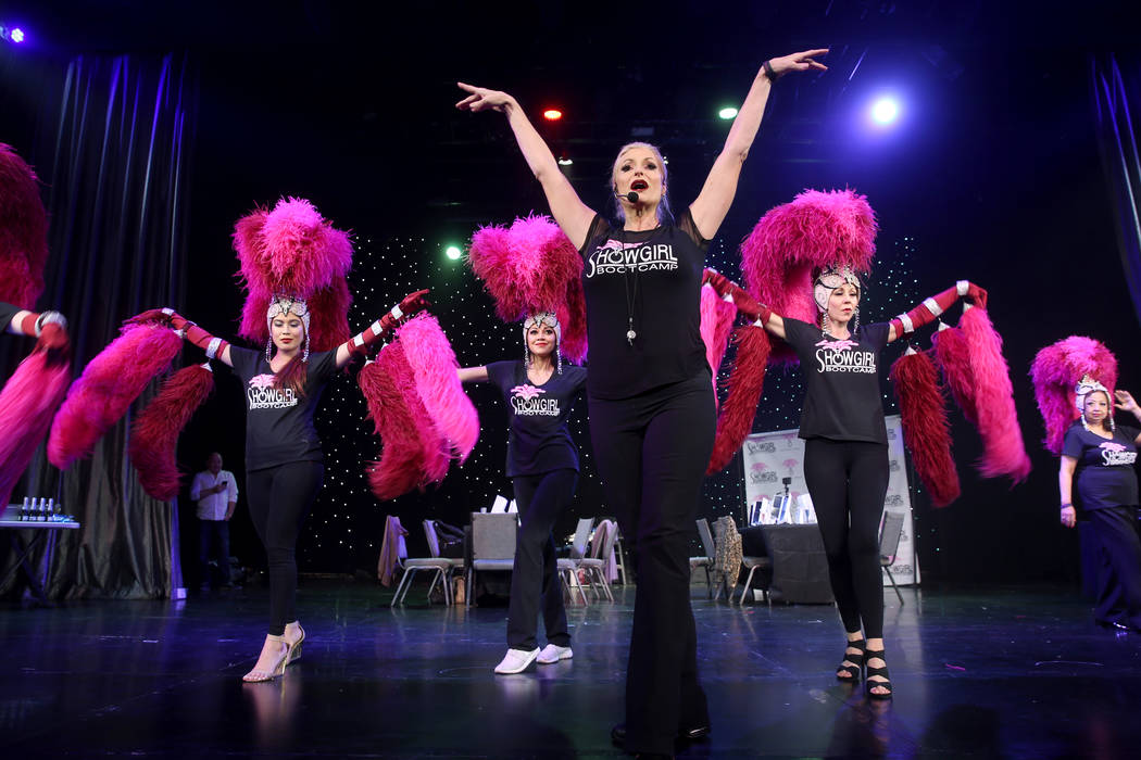 Co-creator Stacy Law-Blind, foreground, teaches the showgirl walk to, from left, Marianne Tanad ...