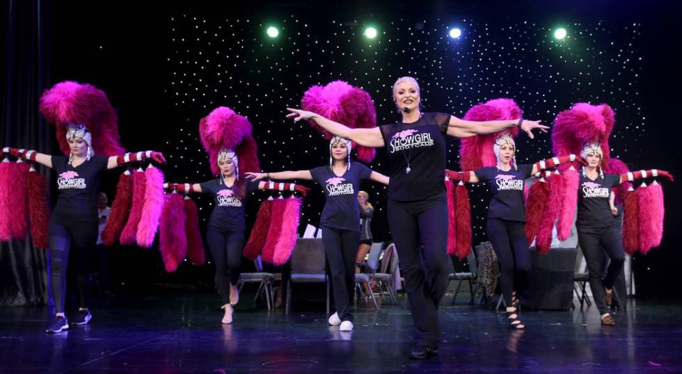 Co-creator Stacy Law-Blind, foreground, teaches the showgirl walk to, from left, Jacqueline Hil ...