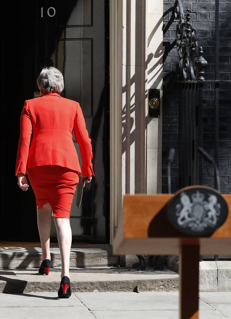 British Prime Minister Theresa May walks away after making a speech in the street outside 10 Do ...