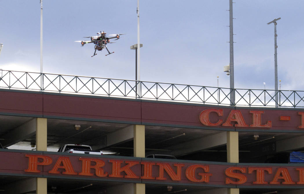 In this May 21, 2019 photo, a drone flies over downtown Reno, Nev., before landing on the Cal-N ...