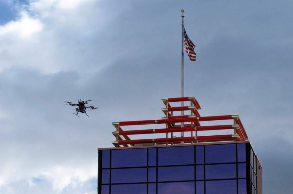 In this Tuesday, May 21, 2019 photo, a drone flies over downtown Reno, Nev., before landing on ...