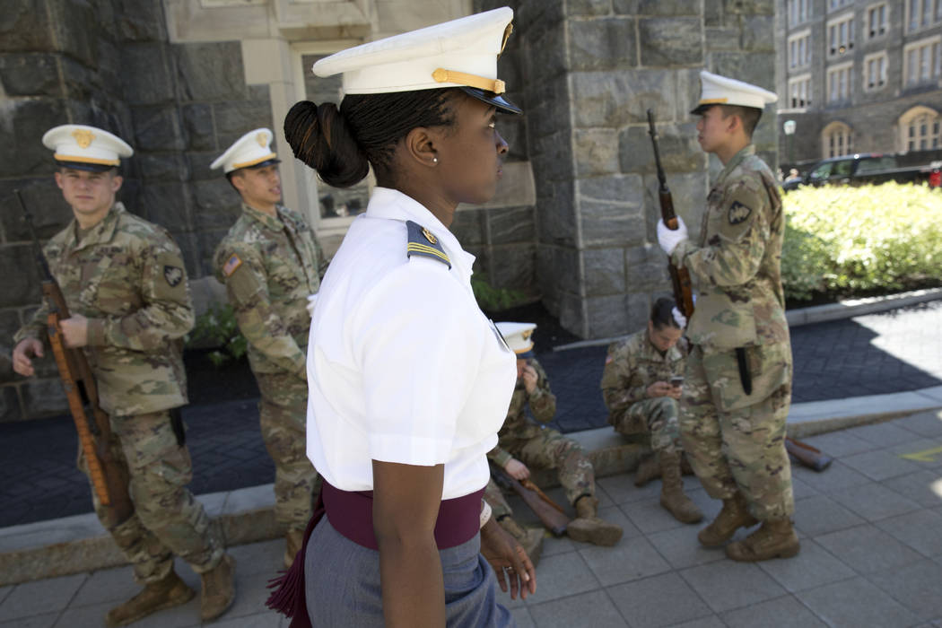 In this May 22, 2019 photo, senior cadet Stephanie Riley, of Jacksonville, Fla., walks across c ...