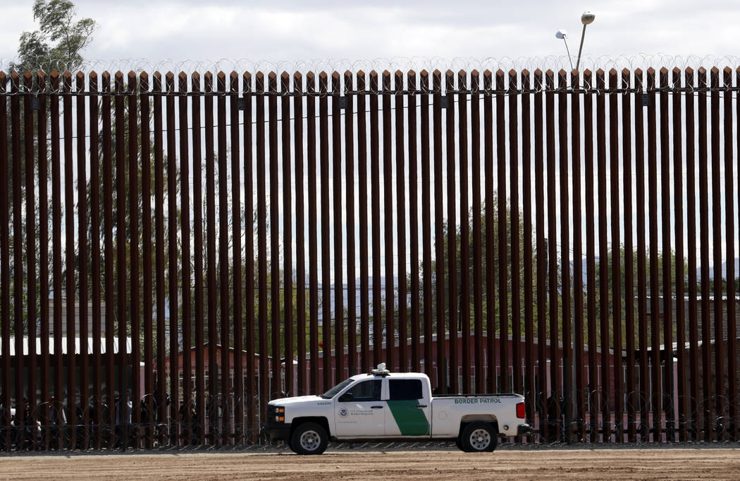 A U.S. Customs and Border Protection vehicle sits near the wall as President Donald Trump visit ...