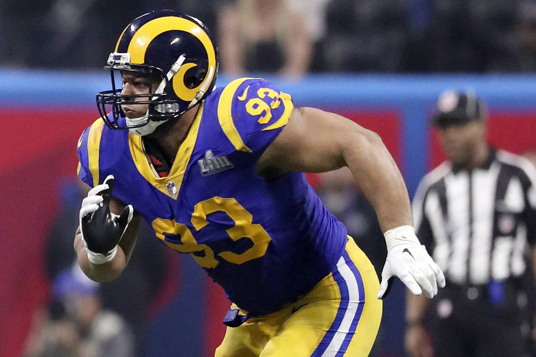 In this Feb. 3, 2019, file photo, Los Angeles Rams' Ndamukong Suh chases the action during NFL ...