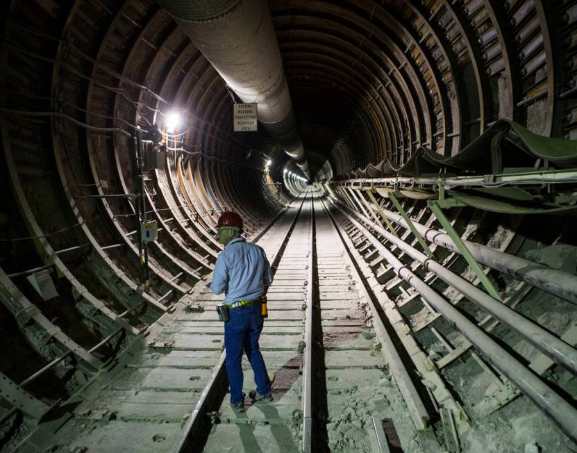 U.S. Rep. Greg Walden, R-Ore., walks through a tunnel extending from the south portal during a ...