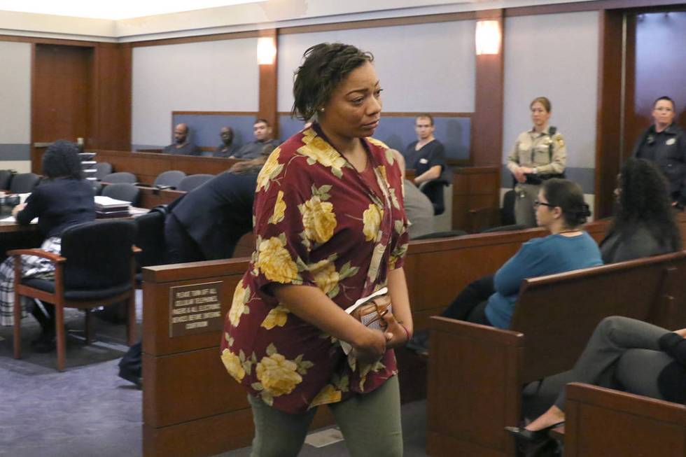 Cadesha Bishop, 25, accused of shoving a 74-year-old man off a bus, leaves the courtroom after ...