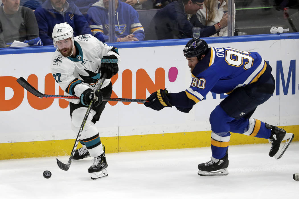 San Jose Sharks right wing Joonas Donskoi (27), of Finland, passes the puck away from St. Louis ...