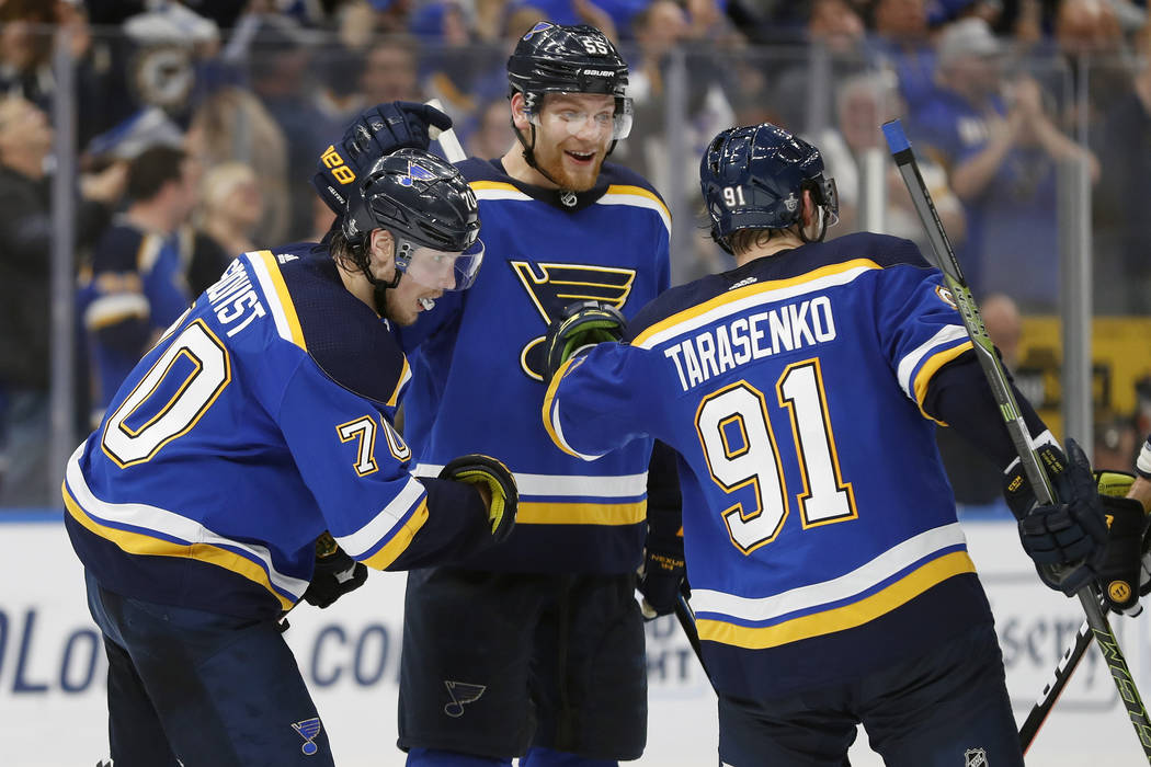 St. Louis Blues center Oskar Sundqvist (70), of Sweden; defenseman Colton Parayko (55); and Vla ...