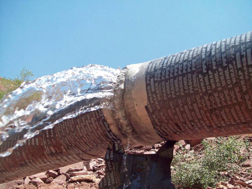 This photo shows water spraying from a break in an exposed section of the Grand Canyon trans-ca ...