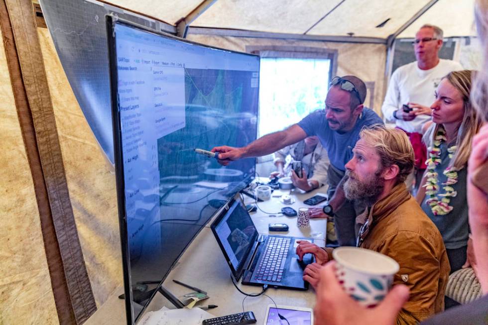 Rescue leads Javier Cantellops, top, and Chris Berquist show some of the technology used for th ...