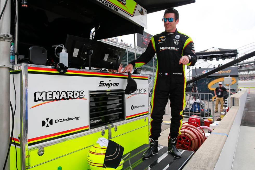 Simon Pagenaud, of France, stand on the pit wall following the final practice session for the I ...