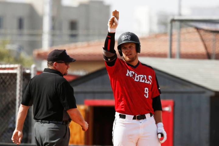 UNLV'S outfielder Max Smith (9) signals to his team after hitting a triple against Air Force at ...