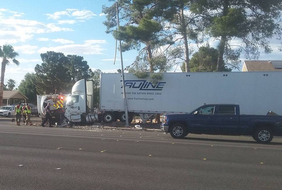 A semi-truck crashed into a residential brick wall on Windmill Lane at Wishing Well Road in Las ...