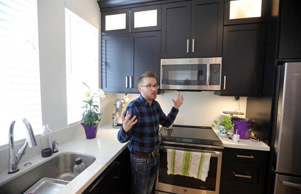 Parry Harrison, 26, speaks during an interview in his townhouse in the Daybreak development, in ...