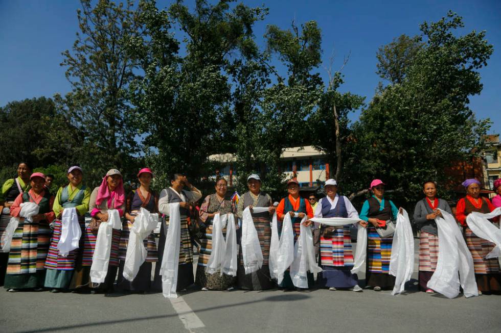 Family members and wellwishers wait to welcome Nepalese veteran Sherpa guide Kami Rita, 49, at ...