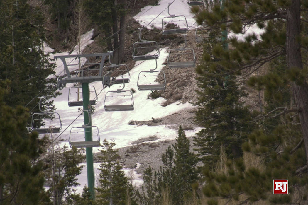 The eaks of Mount Charleston and Lee Canyon Ski area are covered in early morning snow Sunday, ...